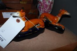 A pair of C19th Staffordshire greyhounds ink holders