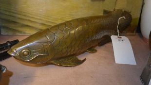 A brass carp of naturalistic form