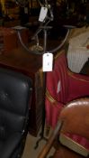 A cast iron floor standing triple pricket candlestick on tripod feet. Height: 128 cm