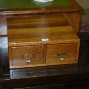 An oak filling cabinet fitted two drawers
