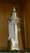 A silver plated cocktail shaker in the form of a lighthouse