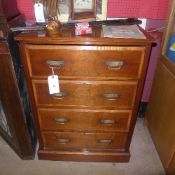 An Arts and Crafts ash chest of four long drawers on plinth base