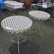 A pair of painted wrought iron pierced conservatory/garden tables