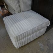 A multi york beige small Ottoman on black feet