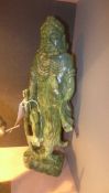 A carved simulated jade figure