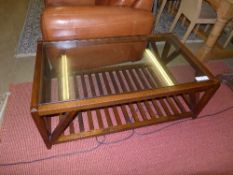 A contemporary oak glass top low table