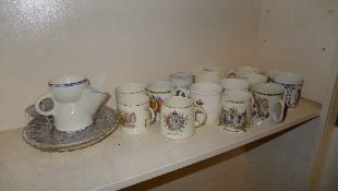 A collection of commemorative mugs
