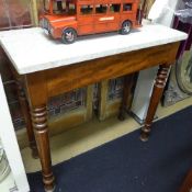 A C19th mahogany console table the white marble top on turned supports