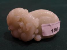 A Chinese jade carving of a dragon with another