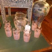 A 1960s glass jug and the matching six glasses with rose decoration