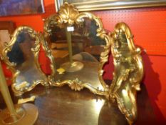 A Continental giltwood triple dressing mirror in scrolling leafy frame