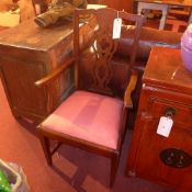 A pair of C19th mahogany elbow chairs with pierced splat backs and drop in seats on stretchered