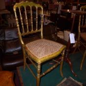 A pair of giltwood salon chairs with carved seats on turned stretchered supports