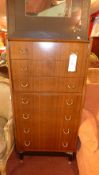 A G-Plan tall chest fitted seven drawers with brass handles