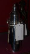 A silver plated lighthouse form cocktail shaker