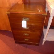 A Campaign style mahogany and brass bound four drawer chest with tooled leather top on plinth base