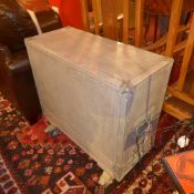 An aluminium flight case raised on castors