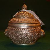 A Chinese white metal insence burner ornately decorated