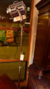 A good quality Mole Richardson brass and steel studio light on telescopic supports and raised on