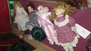 Four various porcelain dolls