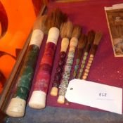 A collection of six Chinese calligraphy brushes with semi precious stone handles