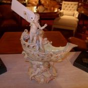 A Continental porcelain comport in the form of a boat and cherubs heightened in gilt