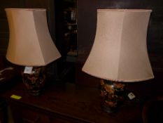A pair of Japanese porcelain table lamps with dragon relief
