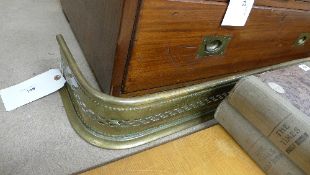 A brass pierced fire surround. Length 100 cm