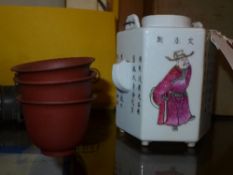 A Chinese porcelain teapot with calligraphy and figural decoration and three terracotta tea bowls