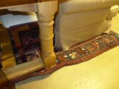 A hand knotted Hamadan rug the red ground with stylized decoration