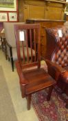 A pair of South African hardwood stick back elbow chairs