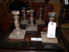 A set of five turned candlesticks