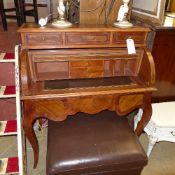 A French style walnut veneerer cylindrical front desk with fitted interior on cabriole supports W