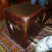 A pair of leather and brass steamer trunks