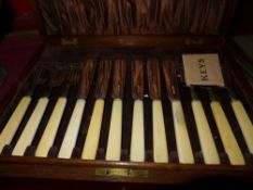 An oak cased canteen of hallmarked silver fishknives and forks with ivory handles assayed in
