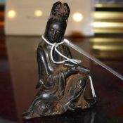 A Chinese cast iron figure of Guan Yin