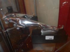 A pair of replica Jaguar car mascot on black bases