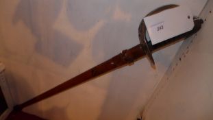 An antique sword with leather sheath