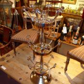 An Art Deco style chrome multi tier revolving shoe rack