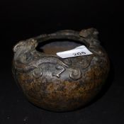A Chinese bronze incense burner decorated with two dragons to the rim