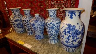 Two pairs of Altfield blue and white vases decorated with flowers and one other similar
