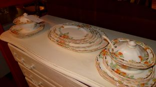 An Alfred Meakin bone china dinner service with Autunm leaf decoration