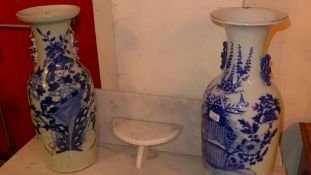 A pair of antique Chinese blue and white vases with floral decoration