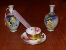 A pair of Royal Worcester miniature vases hand painted with daffodils together with a Worcester