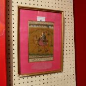 An Indian painting on paper of a woman and camel glazed and framed