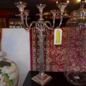 A pair of Corinthian column form silver plated candelabra of five twisted branches on pedestal base