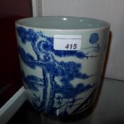 A Chinese blue and white brush pot decorated with bamboo