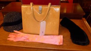 A ladies snakeskin handbag with fitted leather interior