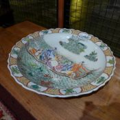 A Chinese charger of large size decorated with figures in the sea