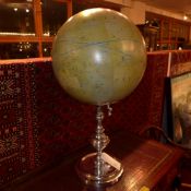 A terrestrial globe of large size on chromed stand